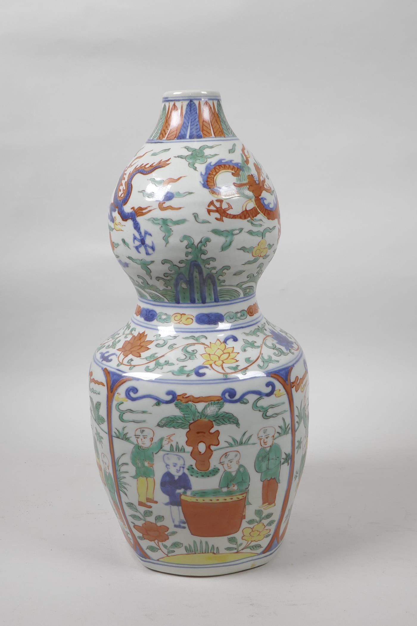 A Chinese wucai porcelain double gourd vase decorated with dragons, lotus flowers and boys at - Image 2 of 5