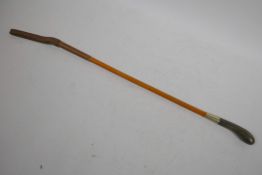A small Swaine riding crop with carved horn handle and Malacca cane, 17" long excluding leather