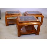 Three matching oriental style figured elm lamp tables, each with inset tinted glass, 25" x 25" x 22"