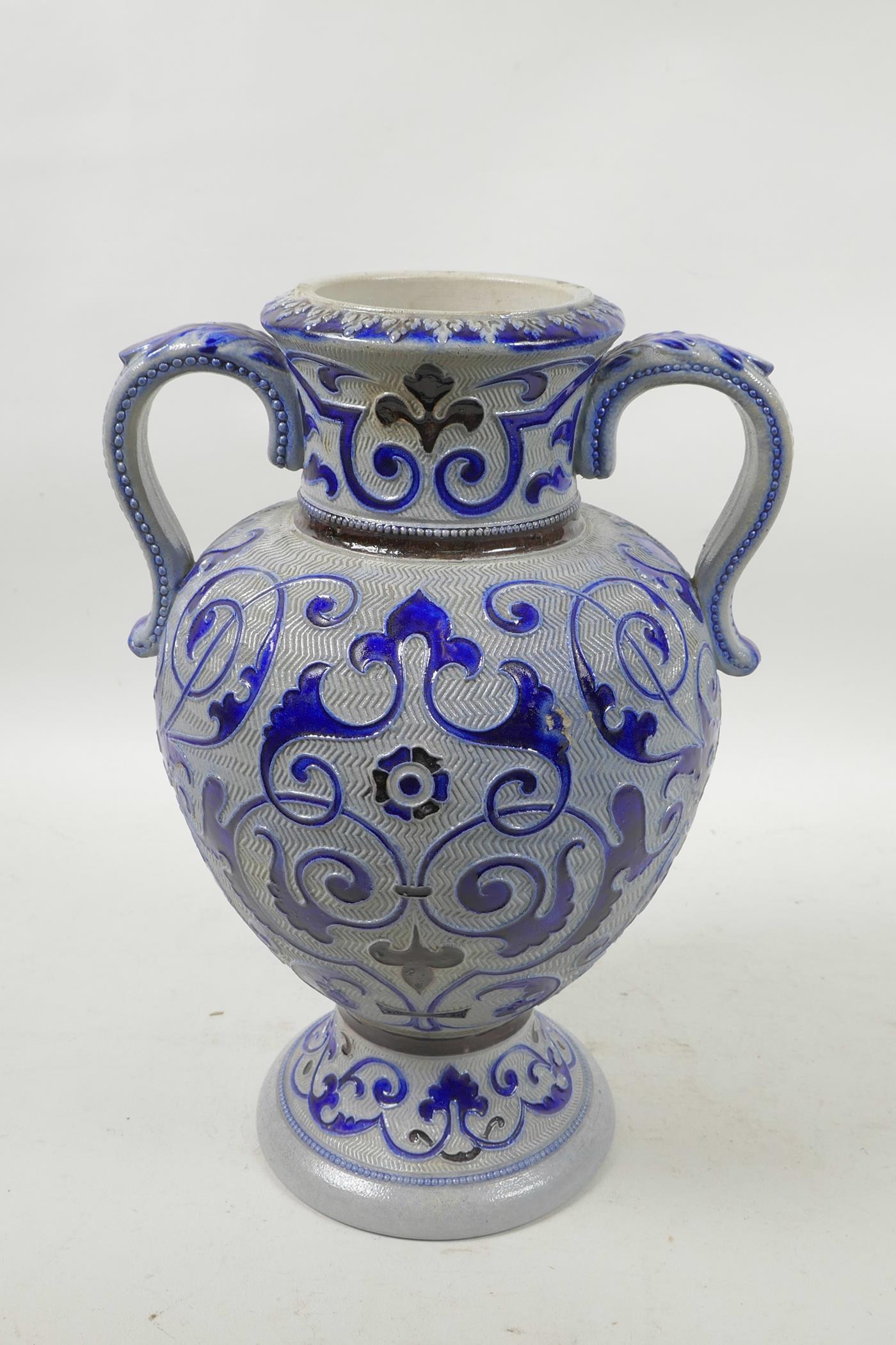 A German salt glazed pottery urn with scrolling blue foliate decoration, 11" high - Image 3 of 4