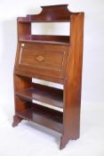 An Edwardian inlaid walnut open bookcase with fall front, fitted with pigeon holes and two pen