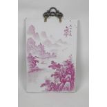 A Chinese porcelain panel decorated with a puce enamelled riverside landscape scene, 10" x 14½"