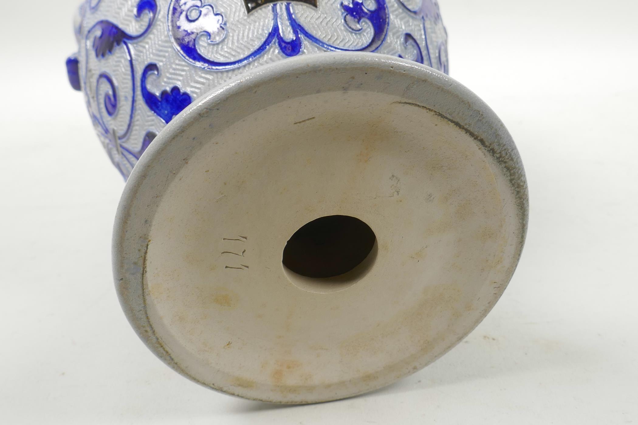 A German salt glazed pottery urn with scrolling blue foliate decoration, 11" high - Image 4 of 4