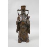 A Chinese carved hardwood figure of a dignitary carrying a ruyi, A/F repair to hand, 12" high