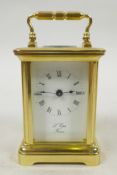 A miniature French L'Epee eight day carriage clock in polished brass and bevelled glass, eleven