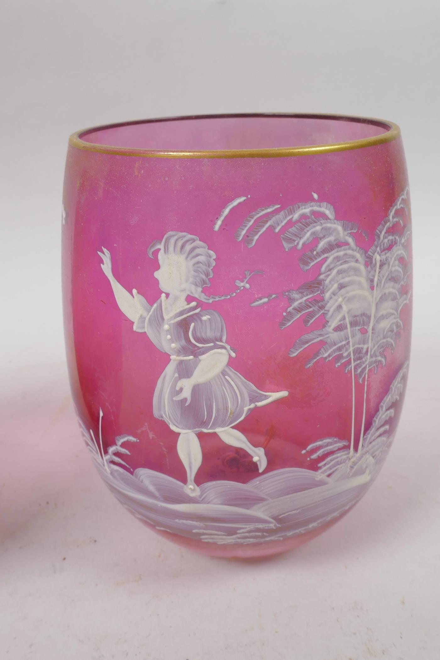 A pair of cranberry glass tumblers with Mary Gregory style decoration of young children and a - Image 3 of 3