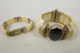 Two Oriental bone and white metal bangles, largest 2½" diameter