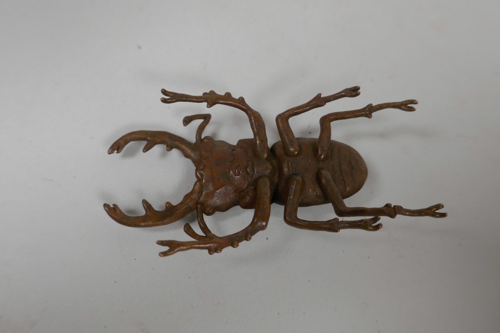 A Japanese Jizai style bronze of a beetle, indistinct impressed marks to base, 3" long - Image 3 of 3