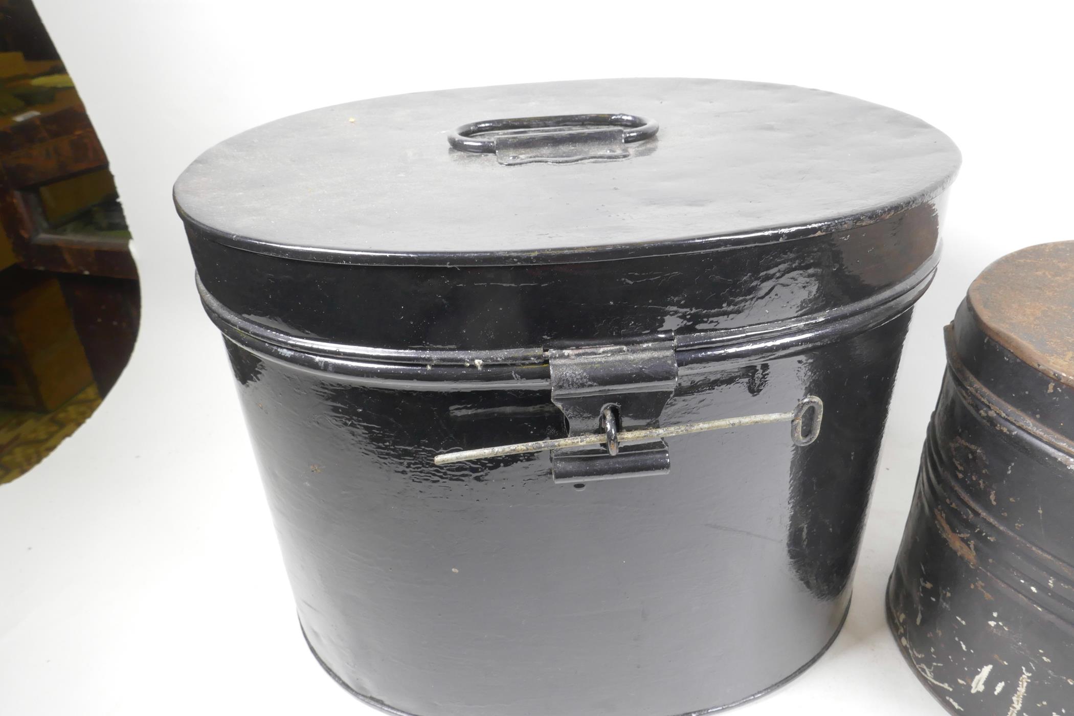 A black painted oval metal hat box, 10½" high, 14" wide, together with another smaller - Image 3 of 3