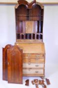 A Georgian inlaid walnut fall front bureau bookcase, the double domed top with two doors opening