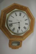 A pine drop dial wall clock with white dial and Roman numerals (no movement), 23" long