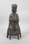 A Chinese gilt and bronzed metal figure of a seated dignitary, 12½" high, 6 character mark verso