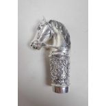 A white metal cane handle in the form of a horse's head, stamped 800, 3½"