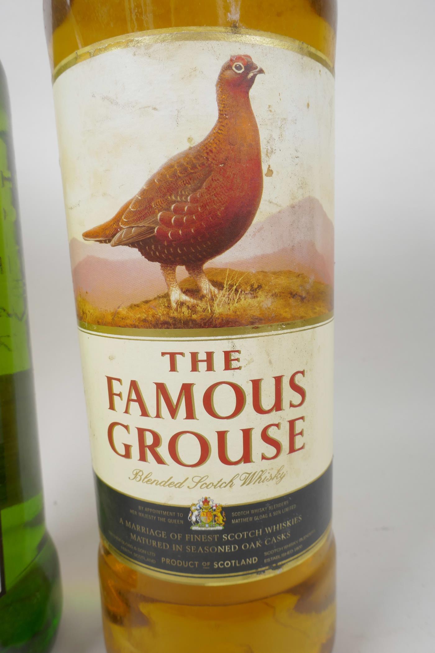 Two one litre bottles of Scotch whisky, one J&B and one Famous Grouse - Image 3 of 3