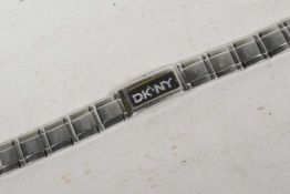 A lady's DKNY stainless steel wristwatch with black dial and DKNY in crystal