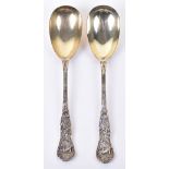 A fine pair of Victorian Bacchanalian pattern parcel gilt salad servers, by Henry John Lias & James