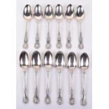 A set of twelve George III fiddle, thread and shell pattern table spoons