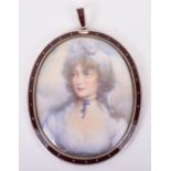 A Georgian gold (inmarked) and enamel mounted portrait miniature