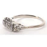 A white gold and four stone diamond ring