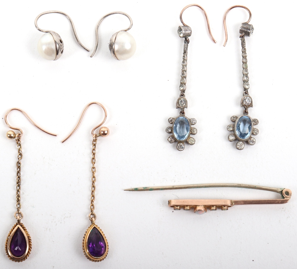 A pair of gold (unmarked) and amethyst drop earrings