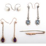 A pair of gold (unmarked) and amethyst drop earrings
