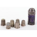 A mixture of six silver thimbles, with an Art Nouveau silver and glass lined pepperette