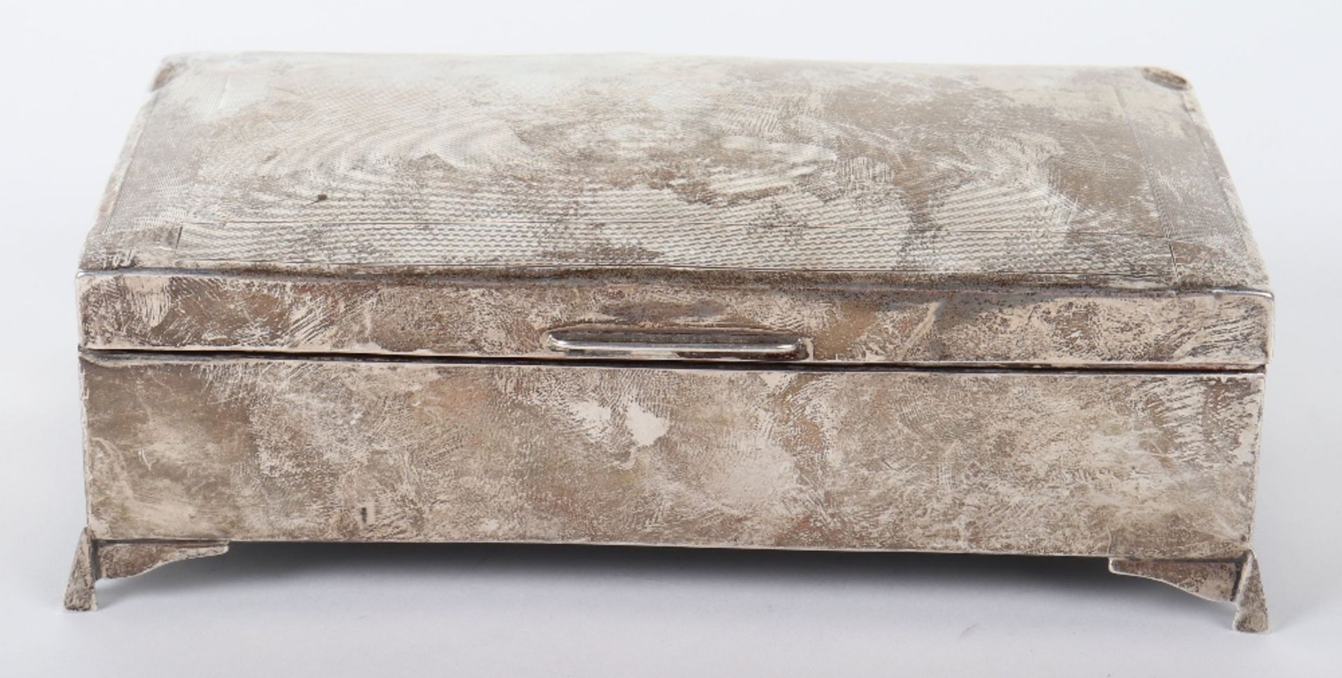 A 20th century silver cigarette box, marked rubbed