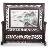 A Chinese porcelain handpainted table screen, on hardwood mount