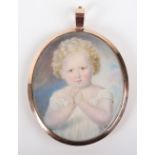 A 19th century miniature bust portrait of a child, on ivory