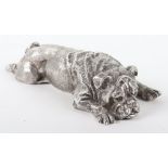 A heavy silver model of a recumbent pug dog, London 1976