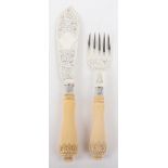 A pair of silver and carved ivory fish servers, William Hutton & Sons, London 1900