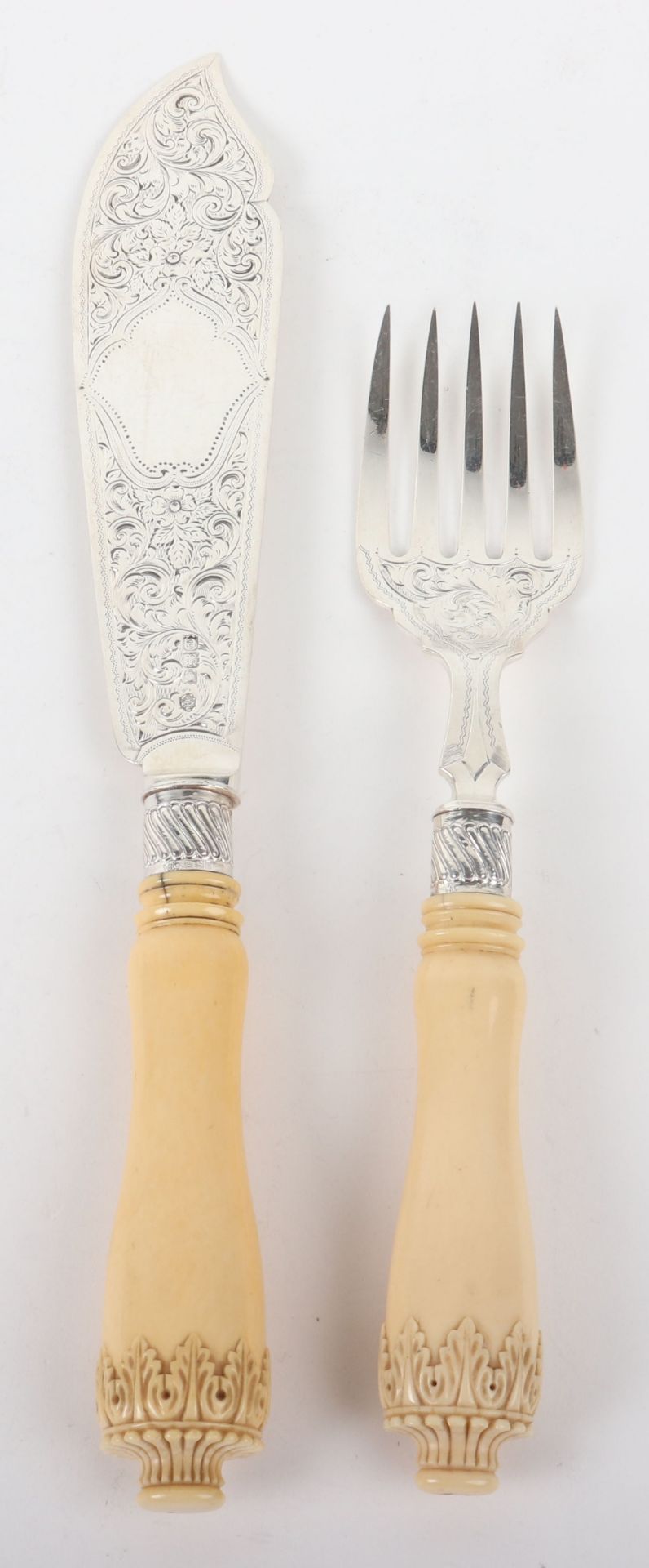 A pair of silver and carved ivory fish servers, William Hutton & Sons, London 1900