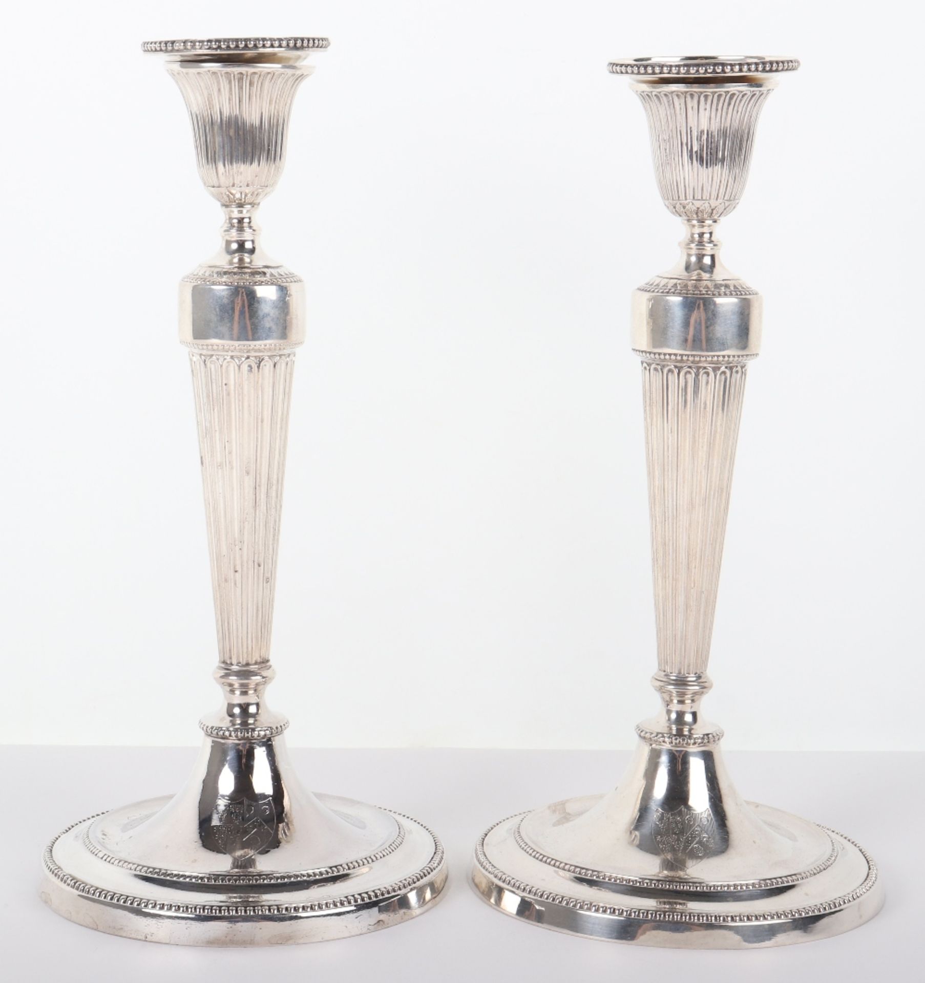 A pair of Georgian silver candlesticks, John Winter & Co, Sheffield 1773