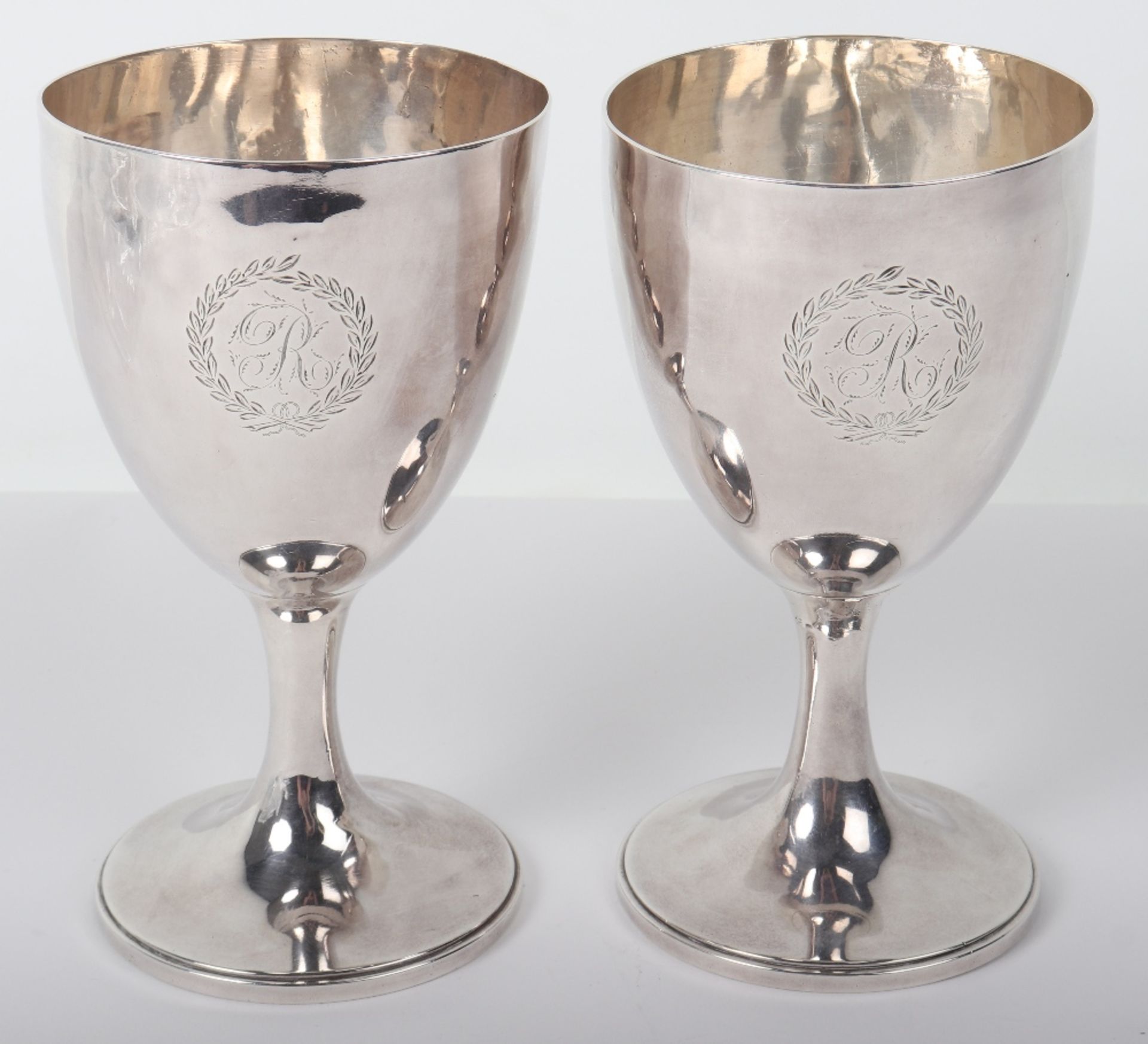 A pair of George III silver goblets, possibly John Dellmester, London 1835