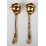 A pair of silver gilt sauce ladles, after Paul de Lamerie, London 1976