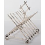 An unusual toast rack in the manner of Christopher Dresser, Hunt & Roskell, London 1867,