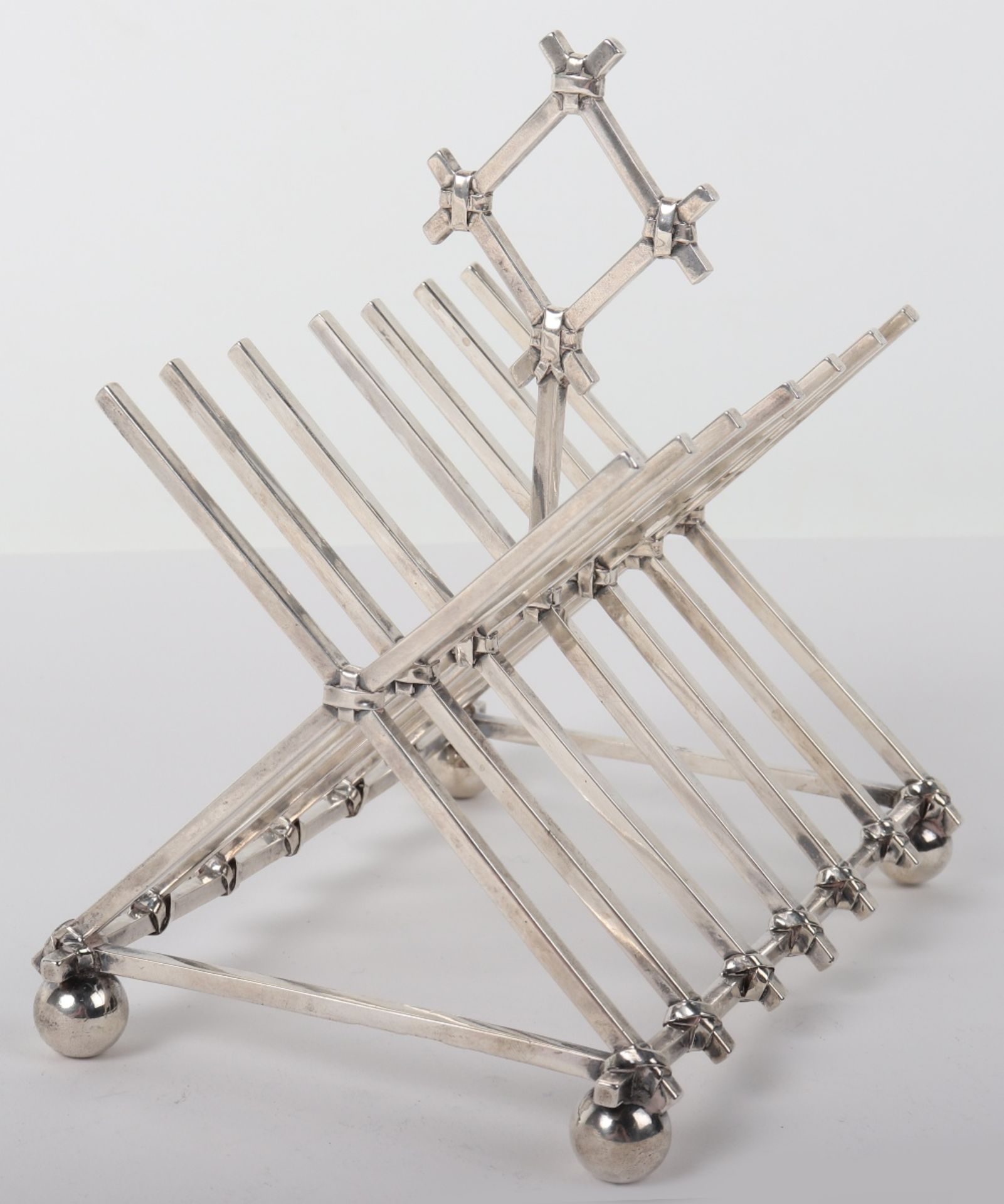 An unusual toast rack in the manner of Christopher Dresser, Hunt & Roskell, London 1867,