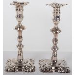 A pair of George II cast candlesticks, markers mark indistinct, London 1754