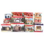 Collection of boxed Hornby track side buildings and accessories,