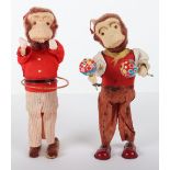 Pair of Japanese tinplate wind-up performing monkeys