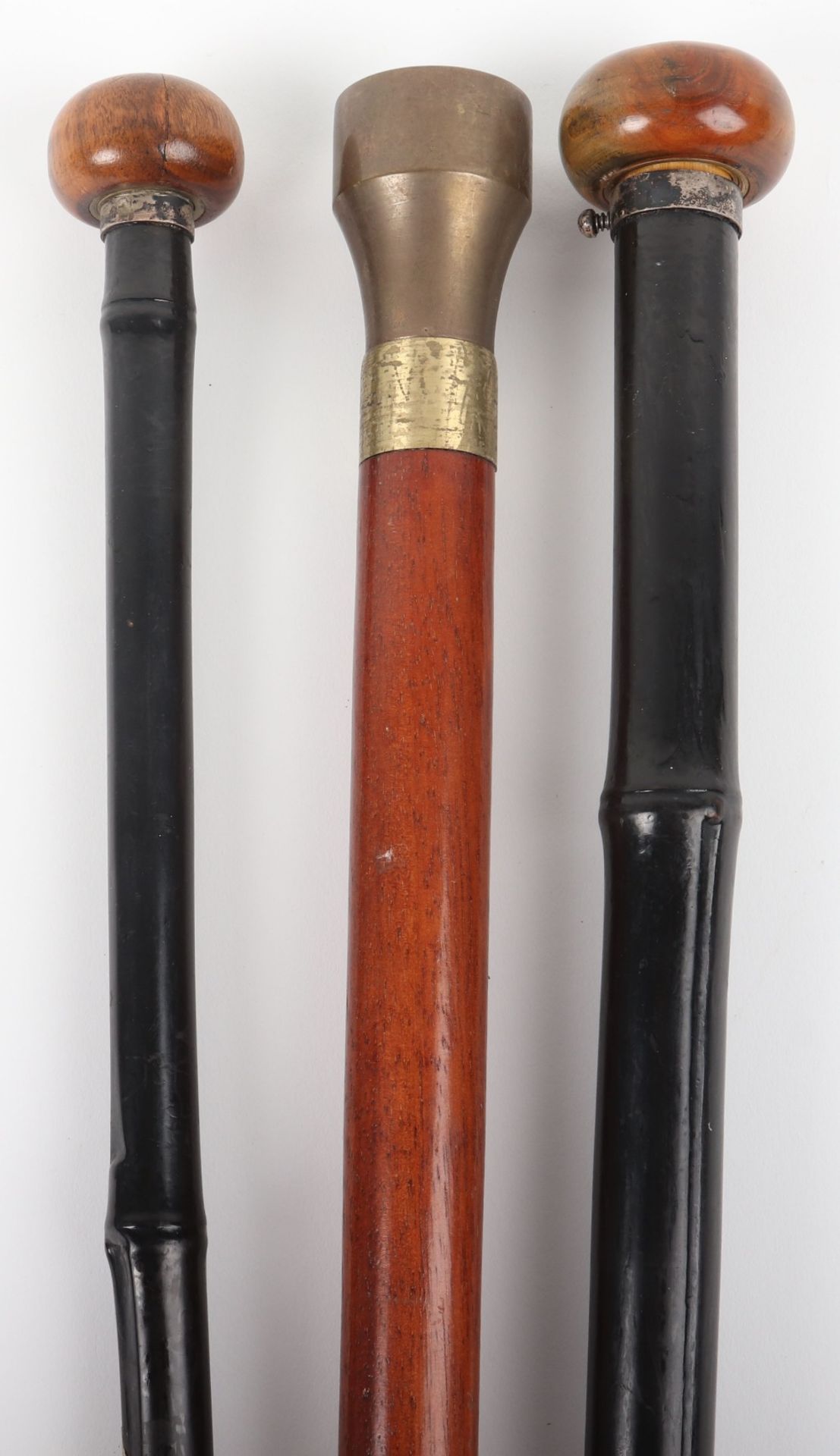 Three novelty walking canes