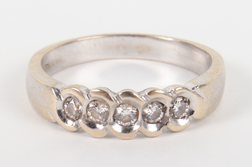 An 18ct white gold and five stone diamond ring