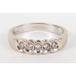 An 18ct white gold and five stone diamond ring