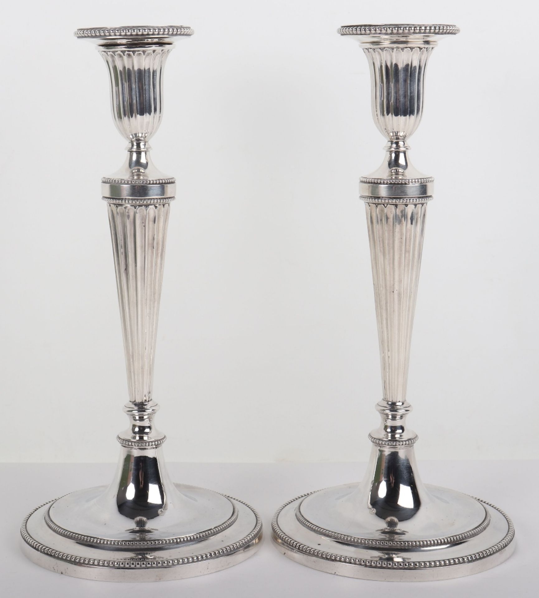 A pair of Victorian silver candlesticks, London 1880, Martin Hall & Co