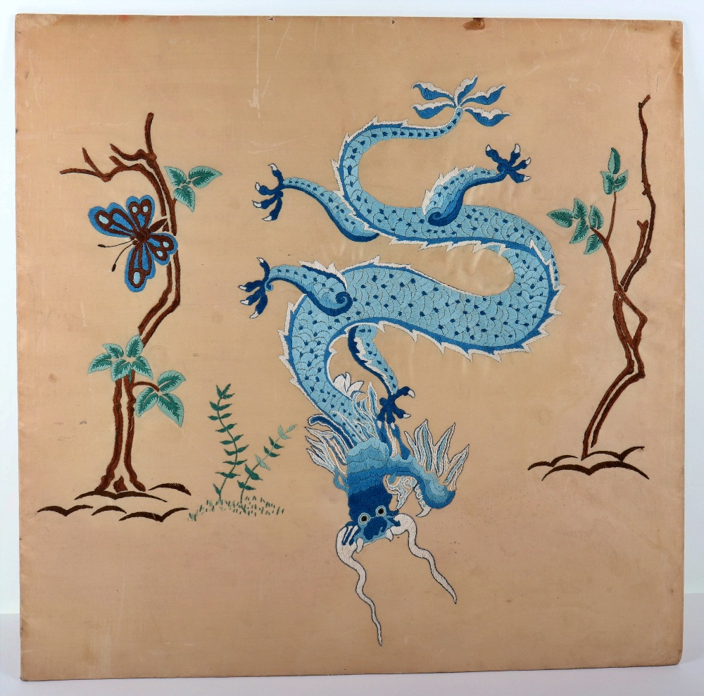 An early 20th century Chinese fire screen (surround missing) silk showing a four claw dragon