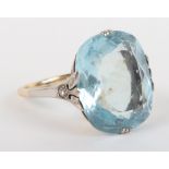 A large aquamarine, diamond, gold and platinum dress ring (marks ineligible)