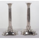 A pair of George II candlesticks, marked WI, London 1752