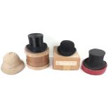 A selection of hats including a Victorian silk top hat with original box with label ‘James Bevan & C