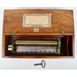 An early 20th century Swiss combed mahogany cylinder music box