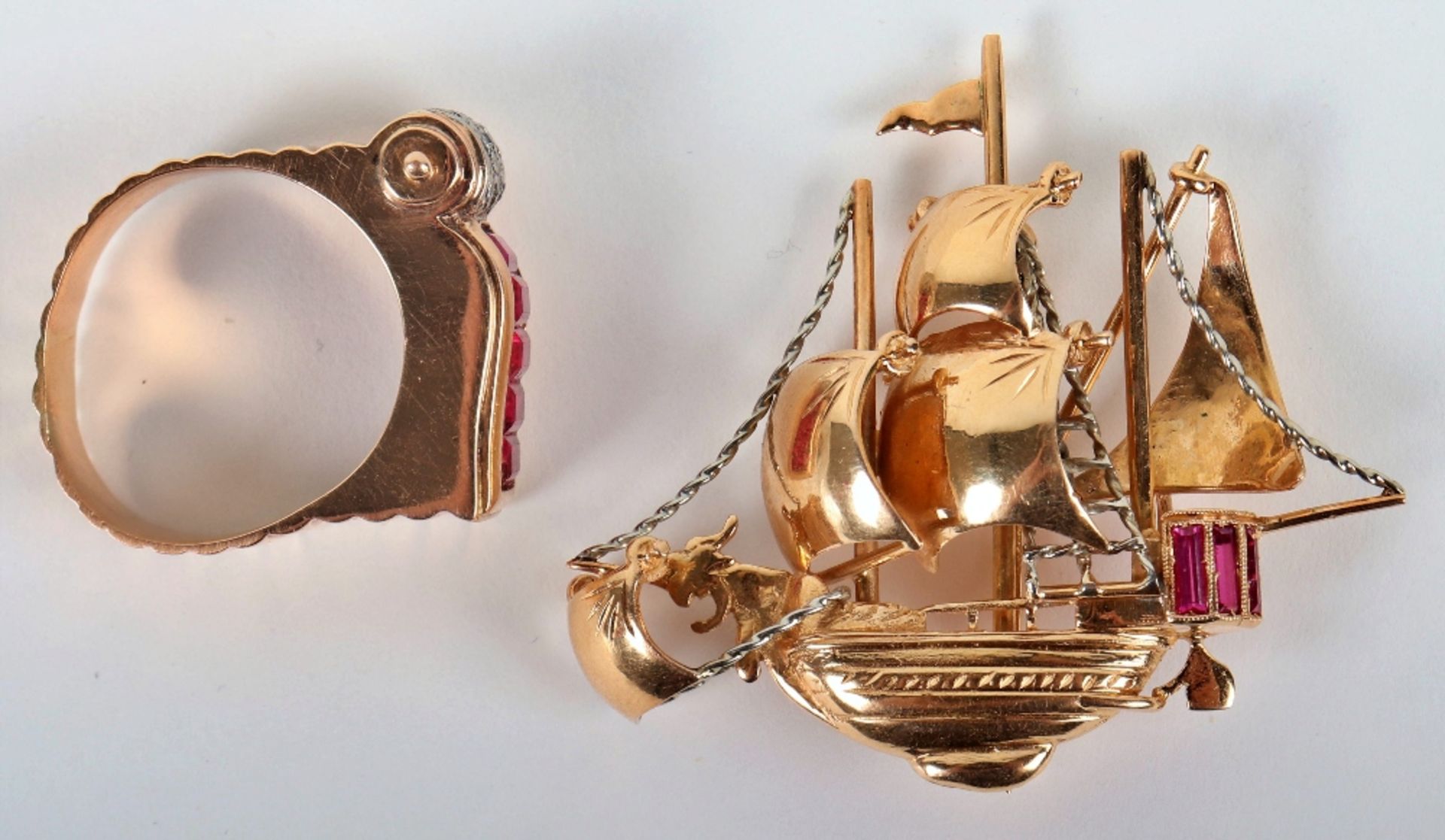 A Continental 18ct gold and ruby (possibly synthetic) brooch in the form of a ship, 5cmWx4.5cmW 11.9